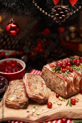 Traditional French terrine covered with bacon and decorated Christmas tree