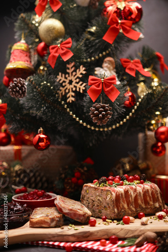 Traditional French terrine covered with bacon and decorated Christmas tree