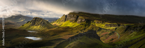 Breathtaking panoramic view taken at The Quiraing on the Isle of Skye, Scotland, UK. Dramatic Scottish landscapes.  photo