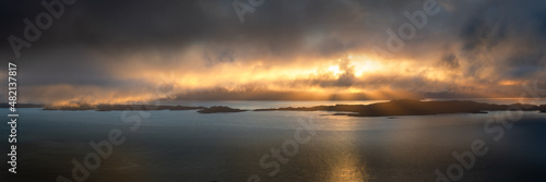 Dramatic panoramic view of Raasay  a group of small islands off the coast of The Isle of Skye in Scotland, UK. Beautiful rays of light breaking through the clouds. © _Danoz