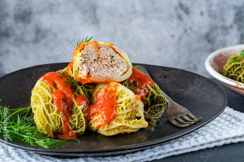 Gołabki - classic Polish dish of cabbage rolls stuffed with pork and rice in tomato sauce