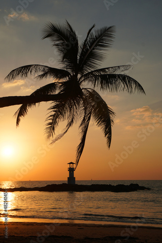 Landscape nature sunset and red twilight sky with Silhouette lighthouse coconut tree at Nang Thong Beach at Khao Lak Phang Nga Thailand - Seascape chill vibe on the beach - beautiful sky 