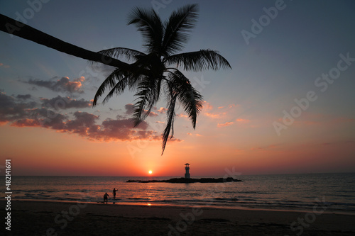 Landscape nature sunset and red twilight sky with Silhouette lighthouse coconut tree at Nang Thong Beach at Khao Lak Phang Nga Thailand - Seascape chill vibe on the beach - beautiful sky 