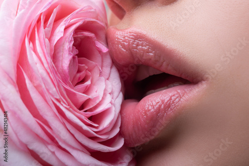 Healthy beautiful young woman with pink lips. Beautiful woman lips with rose.