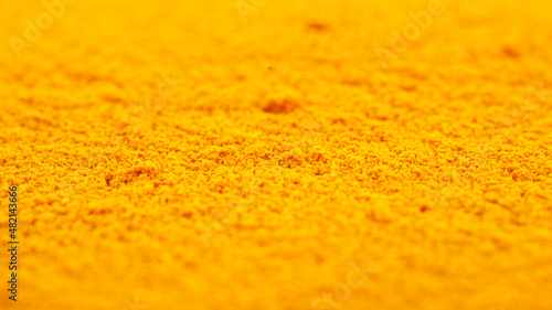 Heap of turmeric powder, background, close-up. Yellow turmeric powder, texture, background. Indian spice, turmeric powder, background. Turmeric powder, texture.