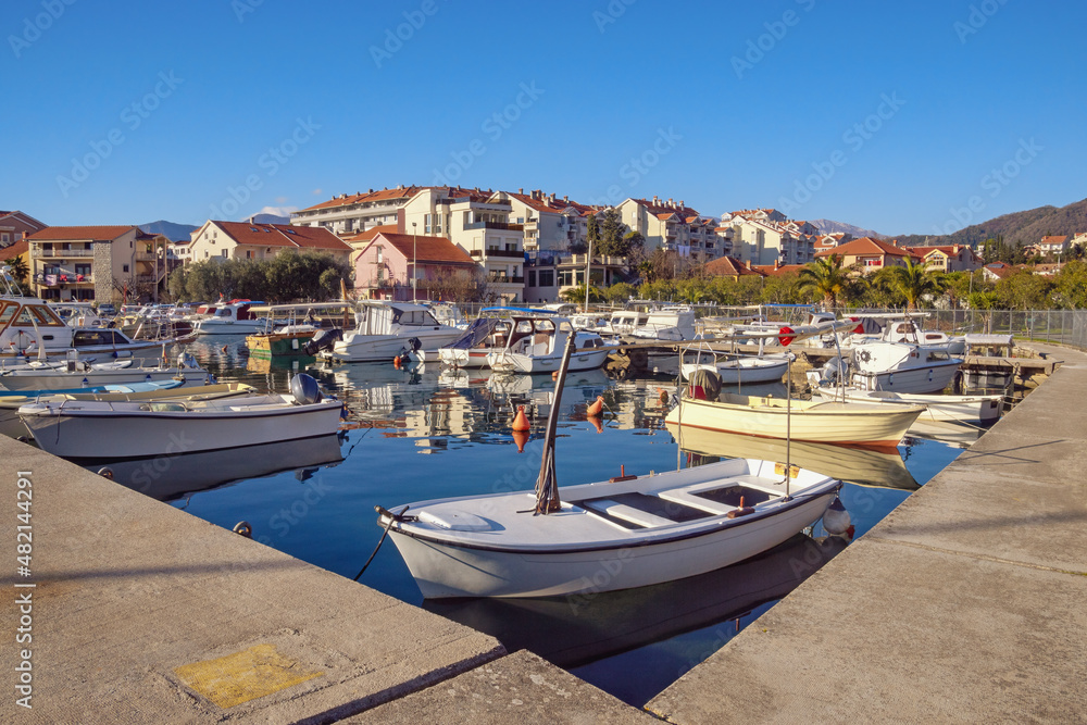 Fishing boats in harbor. Montenegro, Tivat city. View of Marina Kalimanj on sunny winter day