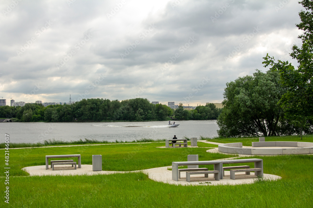 Park on the outskirts of Moscow in the Kapotnya district, view of the Moskva River. Public space for local residents to relax