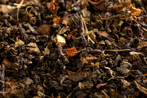 Dry green leaf tea mix. Background, texture