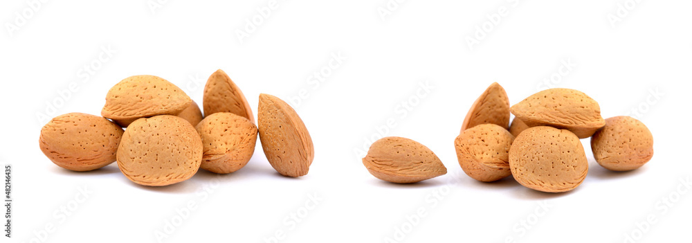 Heap of fresh almonds in shells isolated on white background Heap of fresh almonds in shells isolated on white background