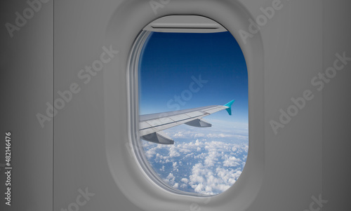Aircraft window view from passenger seat on commercial  airplane