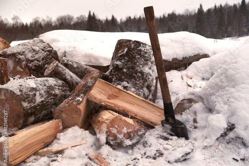 chopping wood with an axe. Male power, flying firewood.