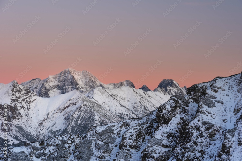 Beautiful winter views of the High Tatra Mountains with tourists, skiers and amazing states of nature