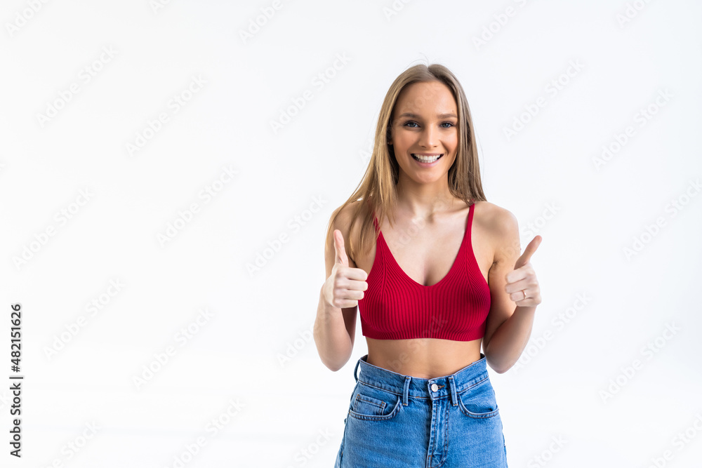 Excited woman with thumbs up isolated over a white backgorund Excited woman with thumbs up isolated over a white backgorund