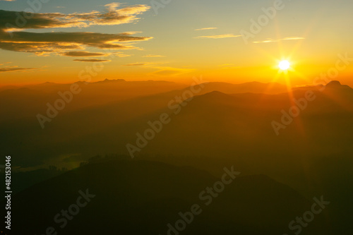 Valley view with villages and mountains at sunrise. View from Adam's peak, Sri Lanka © Curioso.Photography