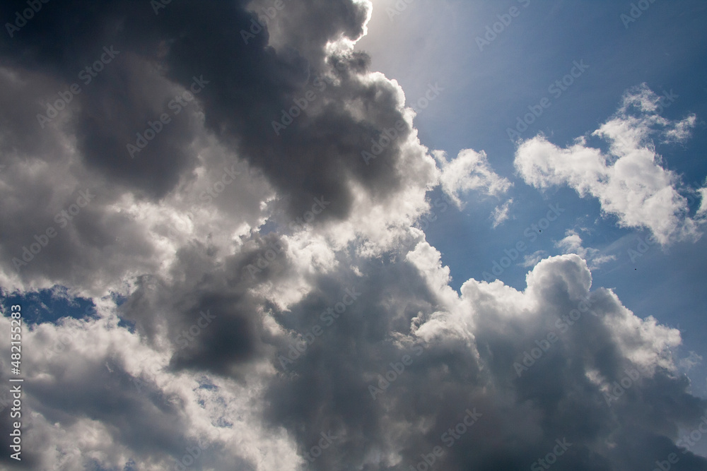Beautiful blue sky with sunbeams and clouds. Sun rays. Beautiful blue sky with sunbeams and clouds. Sun rays.