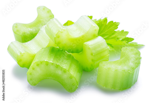 Pile of celery ribs and cuts isolated on white background.
