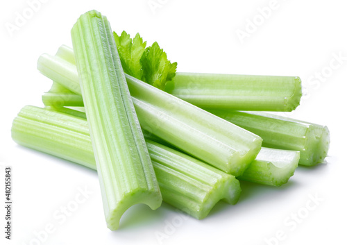 Pile of celery ribs isolated on white background.