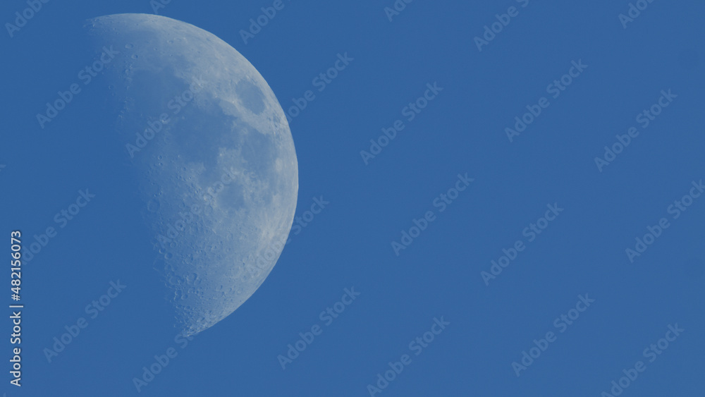 Photograph of Moon in the first quarter lunar phase. Photograph of Moon in the first quarter lunar phase.