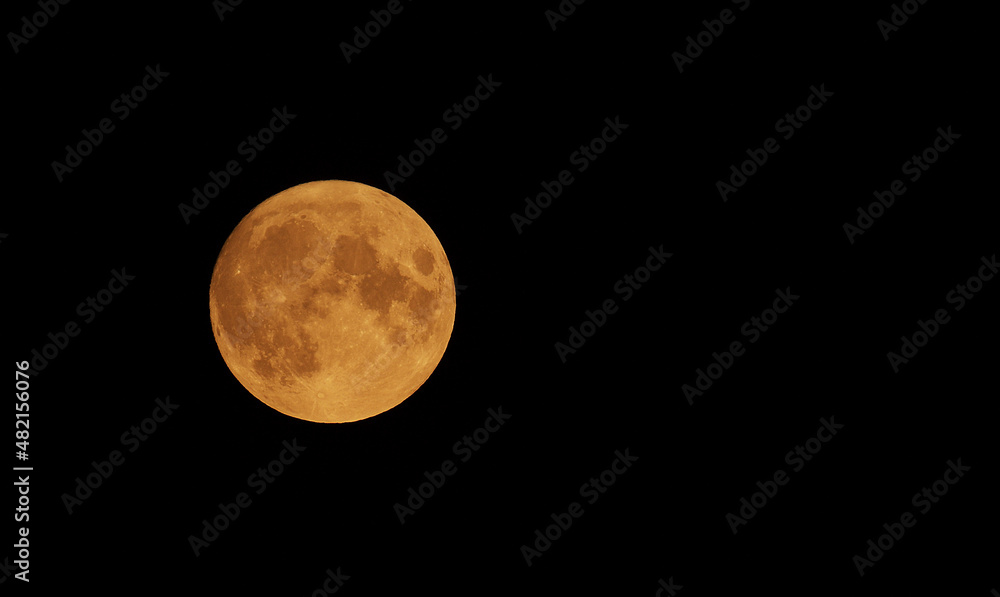 Obraz premium Photograph of Moon in the full moon lunar phase.