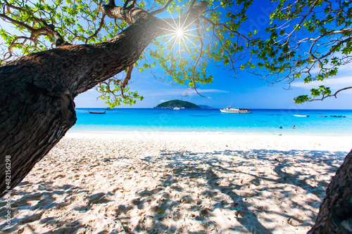 Seascape view of a tropical beach on sunny summer.