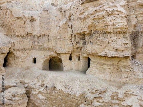 The caves  of the hermits are located near the Deir Hijleh Monastery - Monastery of Gerasim of Jordan in the Judean Desert in Israel photo