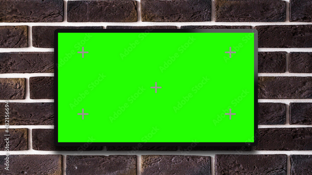 Modern TV Display Green Screen Mock upon Brick Wall. Television Plasm