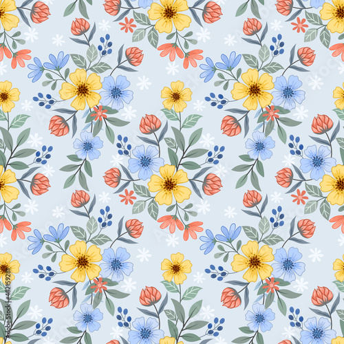 Yellow  orange and blue flowers design seamless pattern.