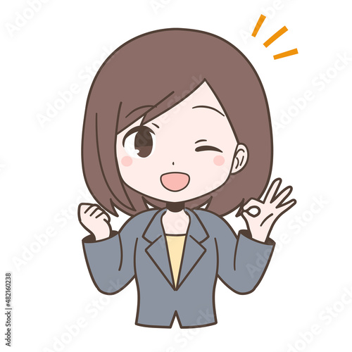 ビジネススーツ姿でOKサインを出す若い女性