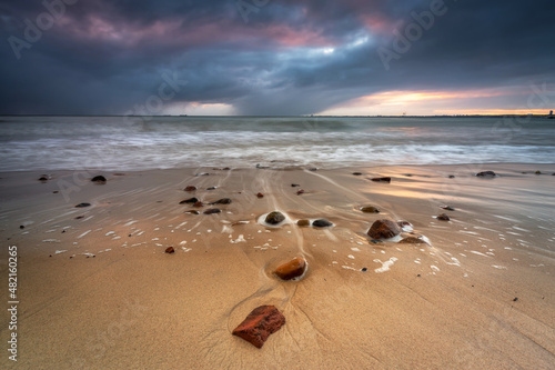 Fototapeta Naklejka Na Ścianę i Meble -  A beautiful sunrise on the Baltic Sea beach in Gdynia Orłowo. Poland