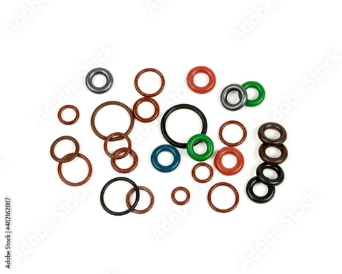 Hydraulic and pneumatic o-rings in different sizes and colors, on a white background. Various seals for plumbing. Sealing rings for hydraulic connections.