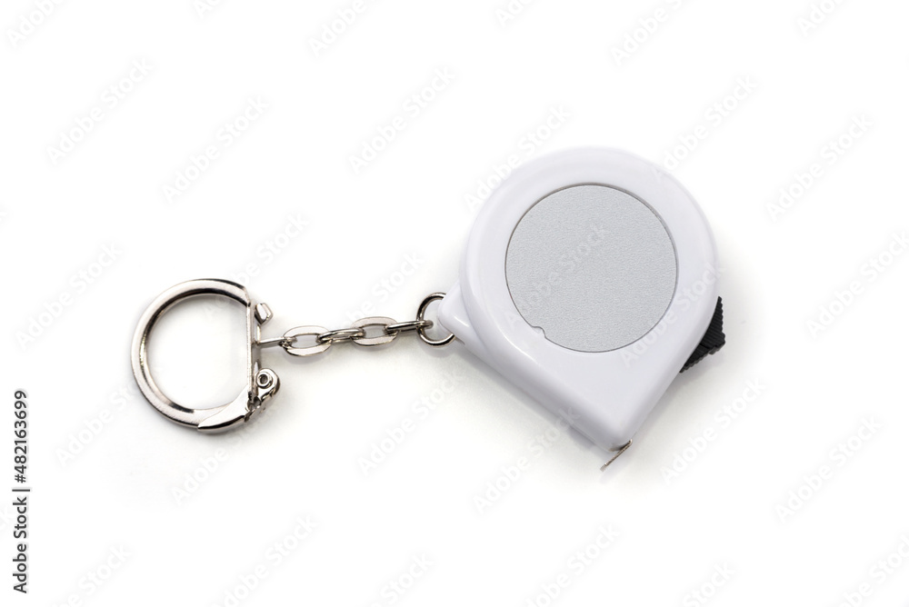 Tape measure keychain on a white background Tape measure keychain on a white background