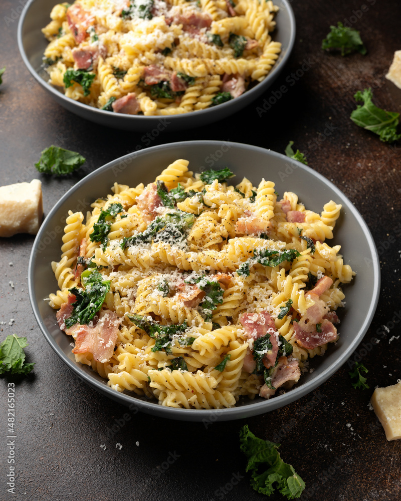 Fusilli pasta with bacon, kale and parmesan cheese. Healthy food Fusilli pasta with bacon, kale and parmesan cheese. Healthy food