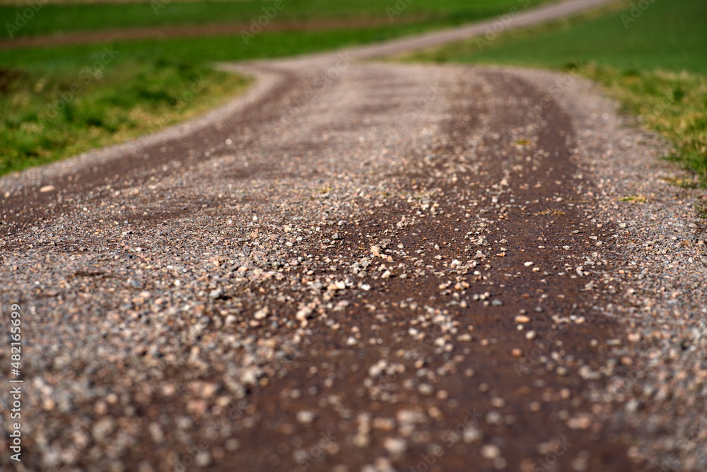 Close-up of rural gravel road with beautiful landscape on a sunny winter day near the airport. Photo taken January 13th, 2022, Zurich, Switzerland. Close-up of rural gravel road with beautiful landscape on a sunny winter day near the airport. Photo taken January 13th, 2022, Zurich, Switzerland.