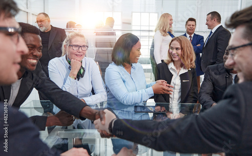 Beautiful business people talking and smiling during a conferenc