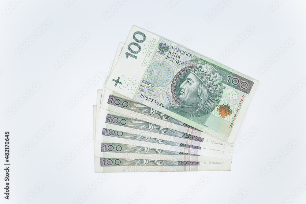One hundred zloty - Polish banknote. Polish currency on a white background arranged in a pattern. Illustrates cash flow and business One hundred zloty - Polish banknote. Polish currency on a white background arranged in a pattern. Illustrates cash flow and business