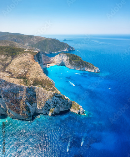 Fototapeta Naklejka Na Ścianę i Meble -  View of Navagio beach, Zakynthos Island, Greece. Aerial landscape. Azure sea water. Rocks and sea. Summer landscape from the air.