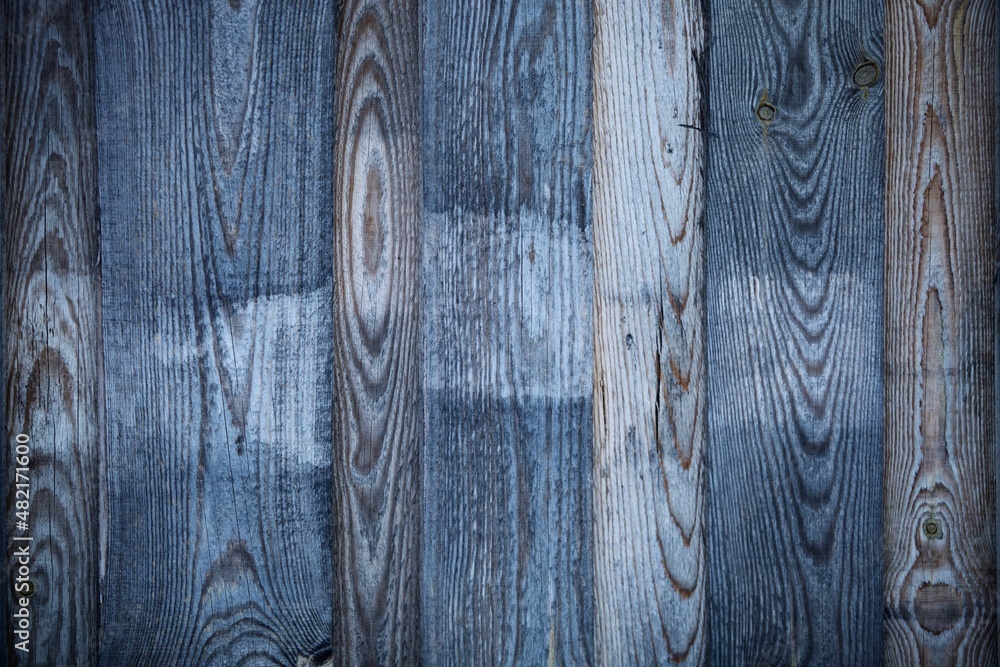 Obraz premium Dark wood boards texture close up. Vintage wooden surface background. Unpainted natural hardwood boards texture. Weathered surface of the old planks of wooden wall close-up. High contrast wood.