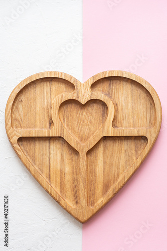 Heart-shaped wooden board for serving. Valentine's day gift