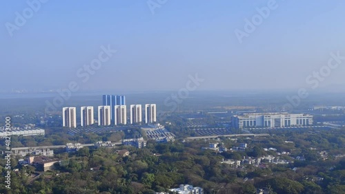 Mumbai city view from Powai area in Vikhroli. Top view of the buildings and houses from Powai in Vikhroli Mumbai Maharashtra with plane passing by from Mumbai airport photo