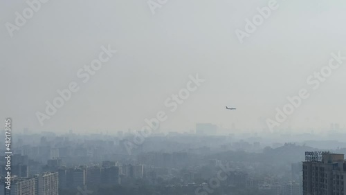 Mumbai city view from Powai area in Vikhroli. Top view of the buildings and houses from Powai in Vikhroli Mumbai Maharashtra with plane passing by from Mumbai airport photo