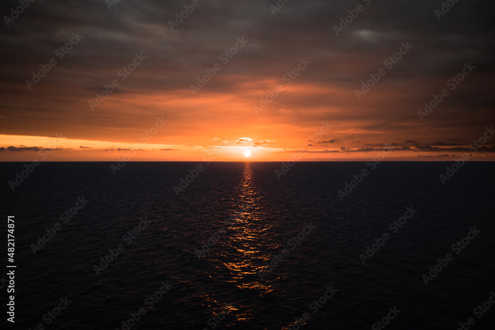 Beautiful sunrise on an open sea shot from a ferry