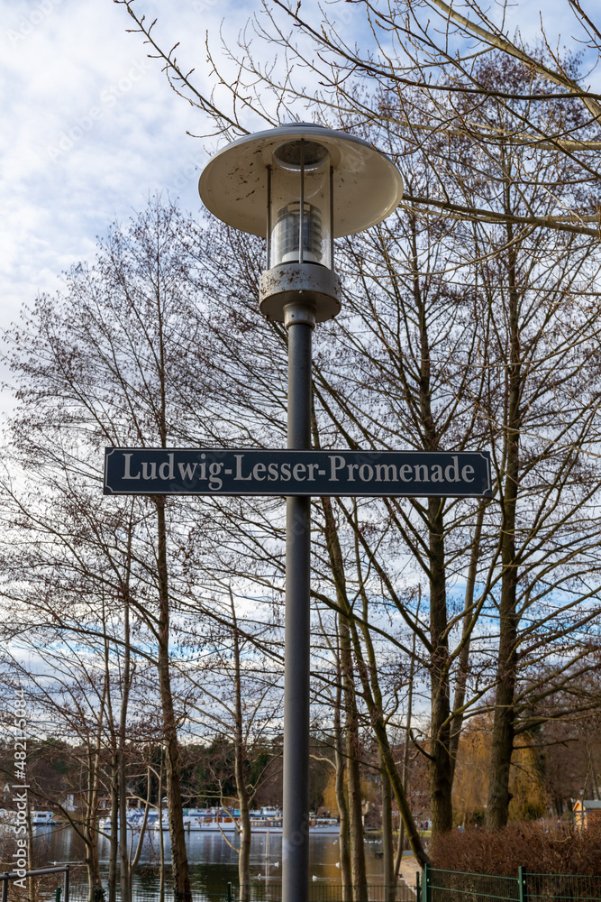 Bad Saarow, Germany, street sign of the Ludwig-Lesser-Promenade that runs along the Scharmutzelsee. Bad Saarow, Germany, street sign of the Ludwig-Lesser-Promenade that runs along the Scharmutzelsee.