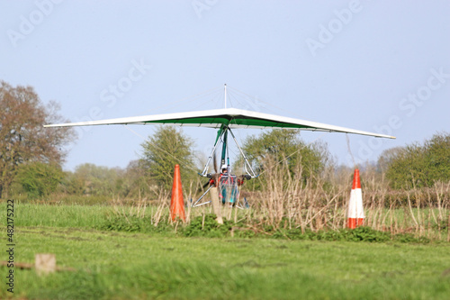 	
Ultralight airplane taxiing on a farm strip	 photo