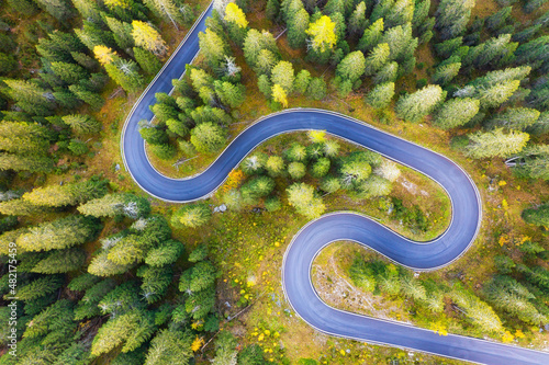 Natural landscape from air. Aerial view on the road and forest at the autumn ...