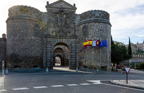 Walls and main entrance gate to the historic city of Toledo. Spain. photo