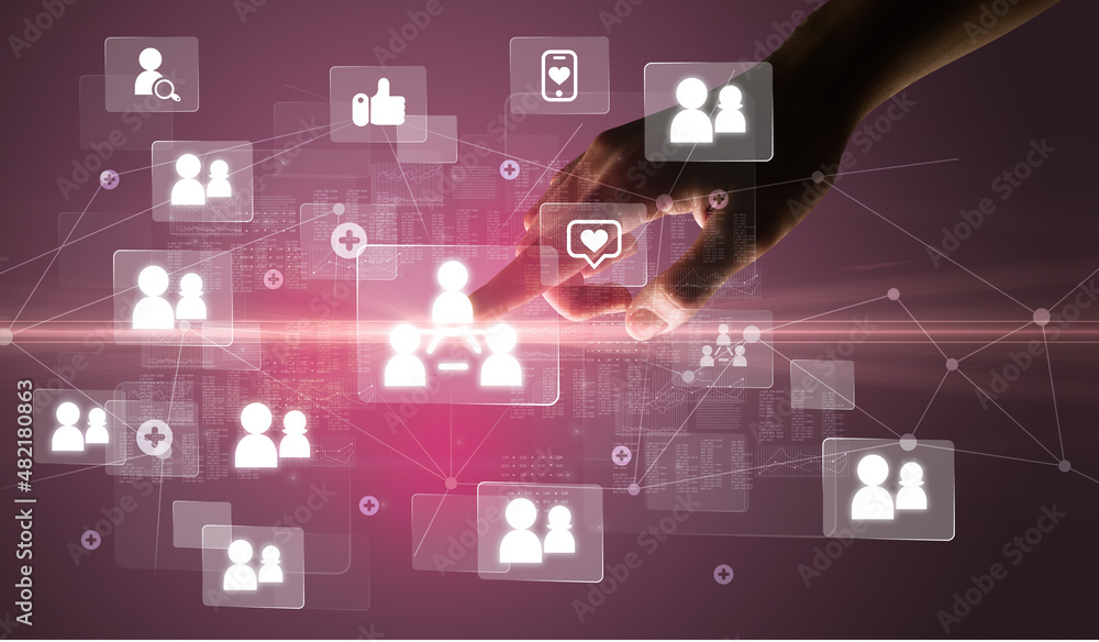 Hand pressing social media multimedia application screen with media icons on futuristic concept Hand pressing social media multimedia application screen with media icons on futuristic concept
