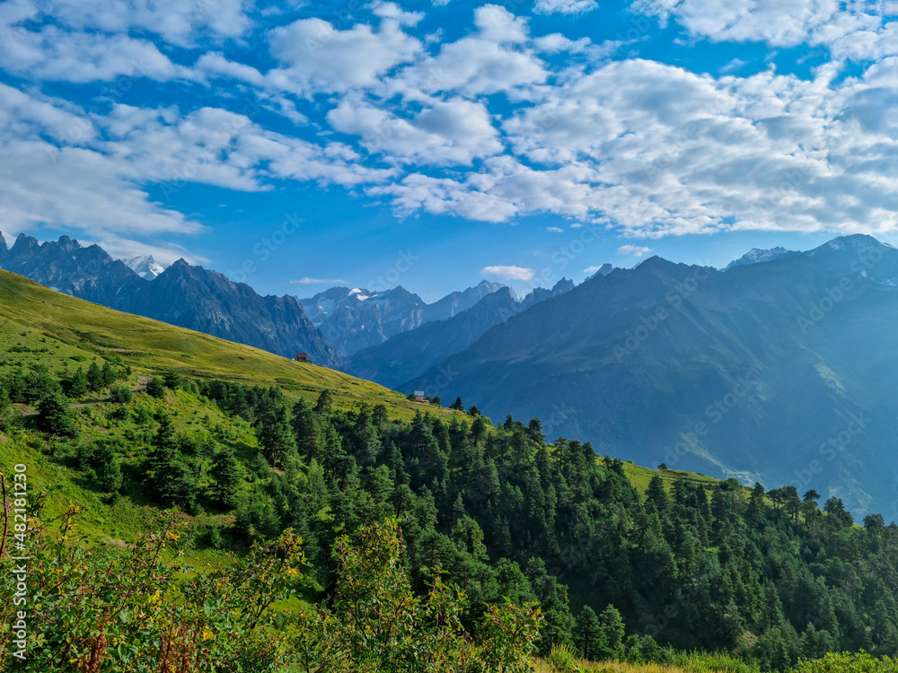 An amazing view on the  Svaneti mountain peaks near Mestia in the Greater Caucasus Mountain Range, Upper Svaneti,Country of Georgia.Hiking trail to the Koruldi Lakes. Dense forest. Cottage,hut