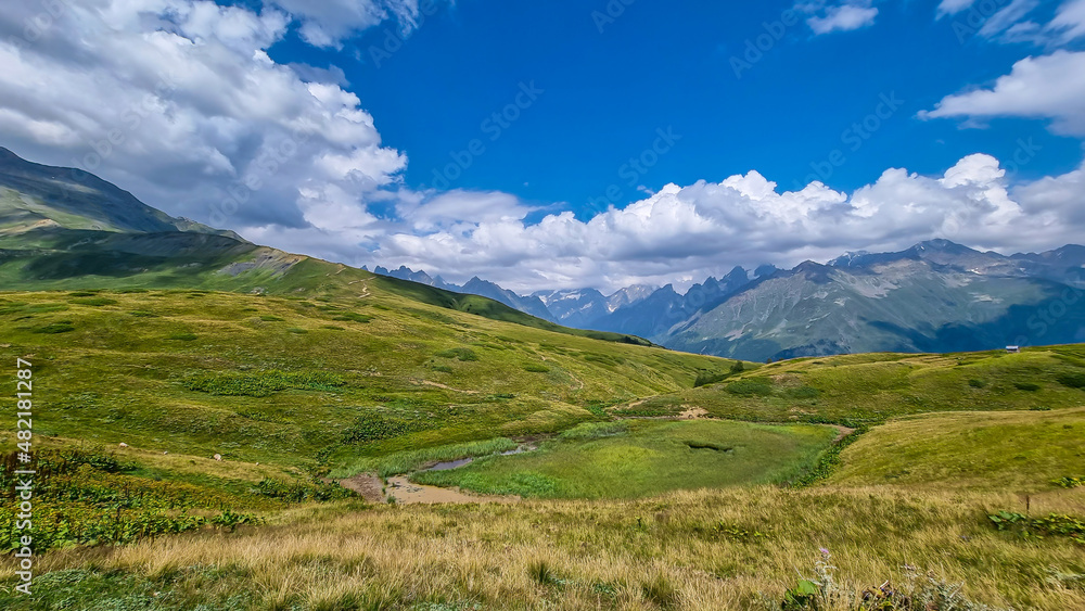 A pond and an amazing view on the sharp Svaneti mountain peaks near Mestia in the Greater Caucasus Mountain Range, Upper Svaneti, Country of Georgia.Hiking trail to the Koruldi Lakes. A pond and an amazing view on the sharp Svaneti mountain peaks near Mestia in the Greater Caucasus Mountain Range, Upper Svaneti, Country of Georgia.Hiking trail to the Koruldi Lakes.