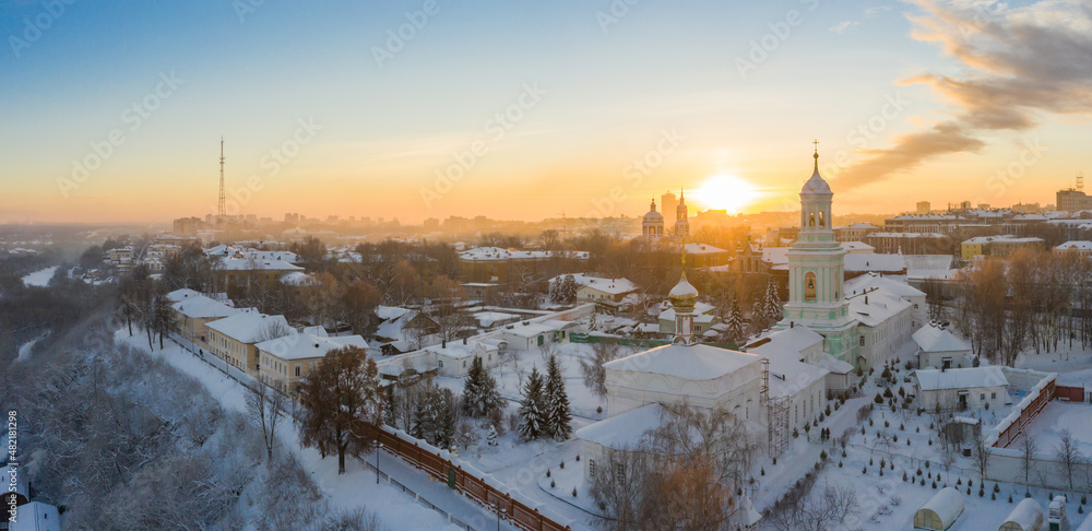 the city of Kirov and the high bank of the river Vyatka and the Alexander Grin Embankment and the rotunda on a sunny winter day.