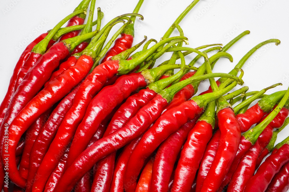 Red hot chili pepper isolated on a white background.
This pile of red chilies is commonly used as a raw material for spicy chili sauce. Red hot chili pepper isolated on a white background.
This pile of red chilies is commonly used as a raw material for spicy chili sauce.